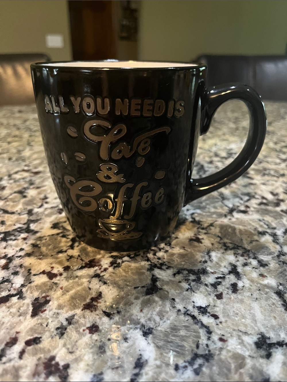 Black Ceramic Coffee Mug with Raised 'All You Need is Love & Coffee' Design